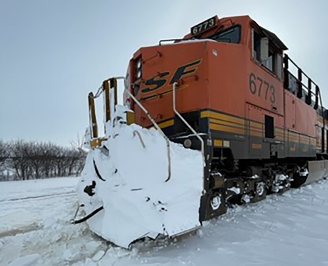 Even trains can get stuck now and then in snow, as this lead locomotive shows.